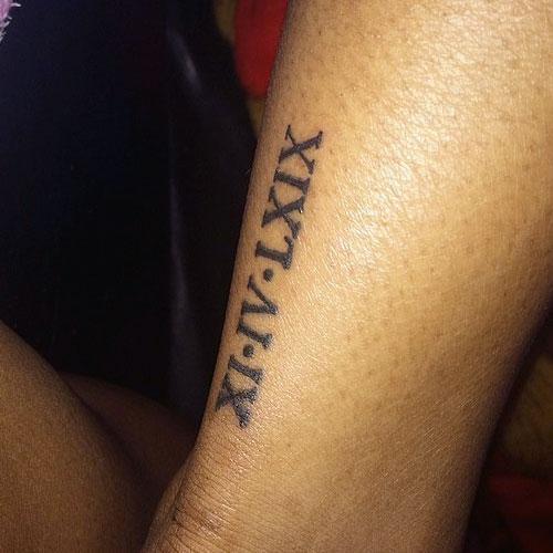 ame roman numeral tattoo ankle