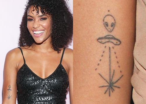annie ilonzeh alien spaceship arm tattoo