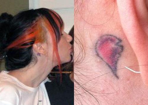 ash costello broken heart behind ear tattoo