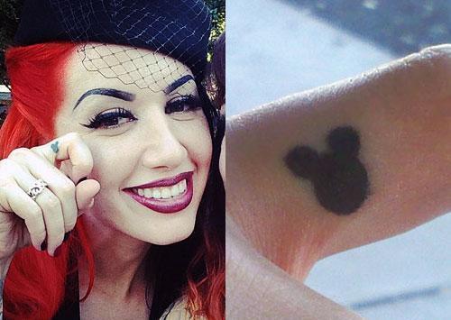 ash costello mickey mouse finger tattoo