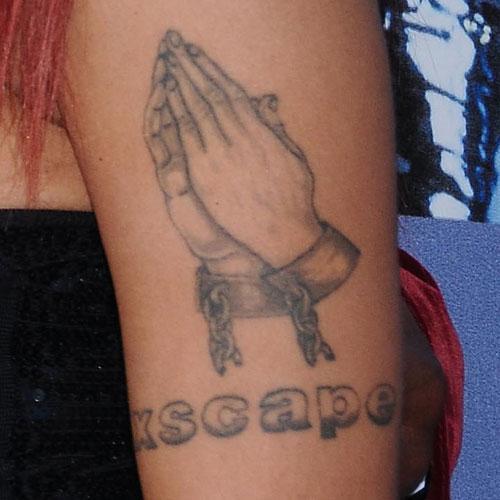 tameka tiny harris prayer arm tattoo