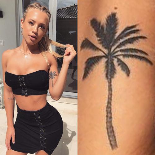 tammy hembrow palm tree bicep tattoo