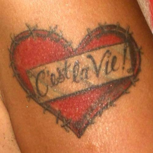 tila tequila heart arm tattoo