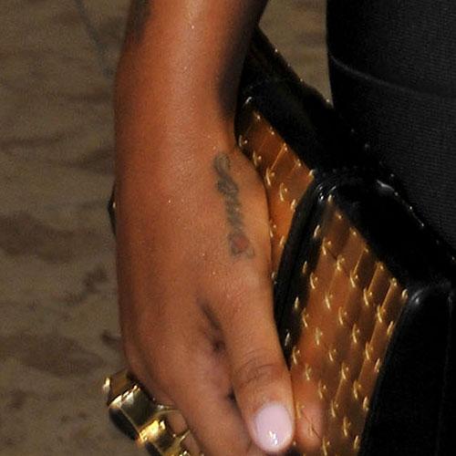 toya wright heart hand tattoo