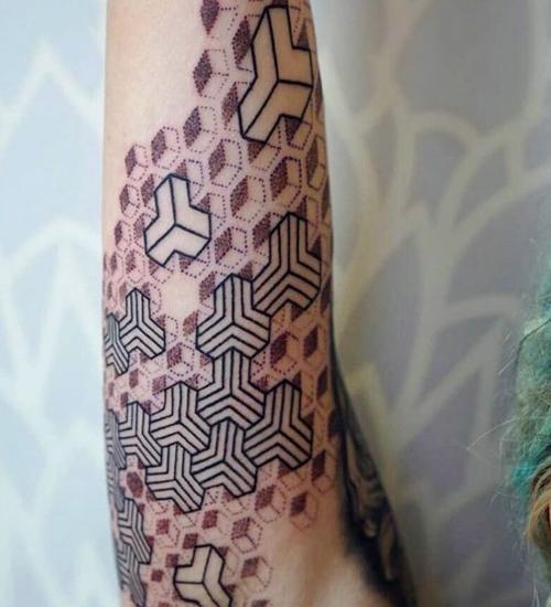 zhavia ward geometric design arm tattoo